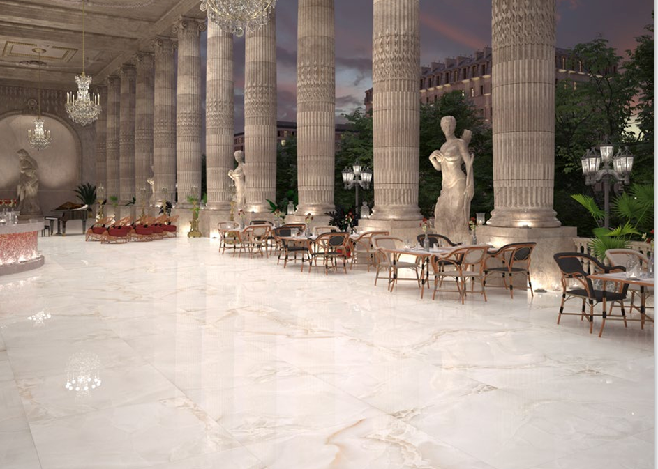 Lobby de lujo con columnas, porcelánico brillante y detalles clásicos.